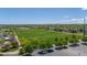 Large green sports field surrounded by a parking lot and trees, creating a wonderful recreational space at 9522 Castle Ridge Cir, Highlands Ranch, CO 80129