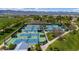 Aerial view of tennis courts, surrounded by trees, providing a fantastic recreational facility at 9522 Castle Ridge Cir, Highlands Ranch, CO 80129