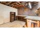 Unfinished basement with shelving, workspace and concrete floors at 7232 Kalamath St, Denver, CO 80221