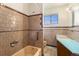 Bathroom featuring neutral tone tile, a bath tub and vintage fixtures at 7232 Kalamath St, Denver, CO 80221