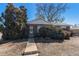 Single-story brick home with tidy front yard landscaping at 7232 Kalamath St, Denver, CO 80221