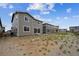 View of new home construction featuring a spacious backyard ready for landscaping at 24737 E 40Th Ave, Aurora, CO 80019
