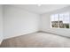 Bright bedroom with a large window providing neighborhood views and plenty of natural light at 24737 E 40Th Ave, Aurora, CO 80019