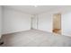 Spacious bedroom with neutral carpet leading to en-suite bathroom at 24737 E 40Th Ave, Aurora, CO 80019