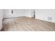 Spacious living room with wood-look floors and natural light, perfect for a comfortable living space at 24737 E 40Th Ave, Aurora, CO 80019