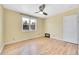 Sunny bedroom with hardwood floors, large window and neutral wall color at 1209 Locust St, Denver, CO 80220