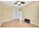 Bright bedroom with hardwood floors, ceiling fan, closet, and adjacent room at 1209 Locust St, Denver, CO 80220