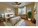 Staged bedroom with decorative rug, modern furniture, and natural lighting at 1209 Locust St, Denver, CO 80220