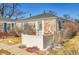 Cozy brick home featuring blue shutters and a well-kept front yard at 1209 Locust St, Denver, CO 80220