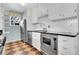 Updated kitchen featuring stainless steel appliances and classic finishes at 1209 Locust St, Denver, CO 80220