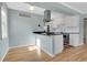 Modern kitchen with stainless steel appliances, ample counter space, and updated lighting at 1209 Locust St, Denver, CO 80220