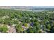 Picturesque community featuring a lake, mountains, and lush greenery at 13990 Berry Rd, Golden, CO 80401