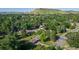 Lush, green neighborhood with mature trees and views of the surrounding mountains at 13990 Berry Rd, Golden, CO 80401