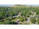 Lush, green neighborhood with mature trees and views of the surrounding mountains at 13990 Berry Rd, Golden, CO 80401