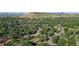 Charming neighborhood surrounded by mature trees with glimpses of well-kept homes and inviting streets at 13990 Berry Rd, Golden, CO 80401