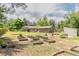 This large lot backyard includes a variety of garden boxes, outbuildings and a covered patio at 13990 Berry Rd, Golden, CO 80401