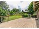 Backyard boasts a large wooden deck with gazebo, perfect for entertaining and enjoying the lush surroundings at 13990 Berry Rd, Golden, CO 80401