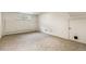 Unfinished basement space with window and access door at 13990 Berry Rd, Golden, CO 80401