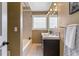 Nicely appointed bathroom featuring a modern vanity, tub and decorative lighting at 13990 Berry Rd, Golden, CO 80401