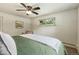 Comfortable bedroom with carpet, ceiling fan, and window view at 13990 Berry Rd, Golden, CO 80401