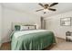 Cozy bedroom with plush carpet, ceiling fan, and closet space at 13990 Berry Rd, Golden, CO 80401