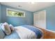 This bedroom boasts hardwood floors and ample closet space at 13990 Berry Rd, Golden, CO 80401