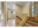 Entryway with stairs leading to a room with bright blue walls and wood floors at 13990 Berry Rd, Golden, CO 80401