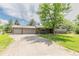 Charming single Gathering home with a brick exterior and a spacious two car garage at 13990 Berry Rd, Golden, CO 80401