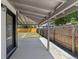 Spacious back patio overlooking a backyard and featuring a wooden fence at 1670 S Quieto Ct, Denver, CO 80223