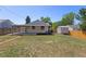Large backyard featuring a patio and storage shed, offering space for outdoor activities at 1670 S Quieto Ct, Denver, CO 80223