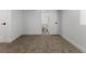 Finished basement room near bathroom area featuring neutral carpet and white walls and trim at 1670 S Quieto Ct, Denver, CO 80223