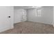 Finished basement bedroom featuring neutral carpet, white walls and trim, and a modern door at 1670 S Quieto Ct, Denver, CO 80223