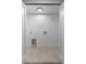Clean laundry room featuring tile flooring, and washer dryer hookups at 1670 S Quieto Ct, Denver, CO 80223