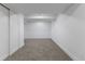 Spacious finished basement room featuring neutral carpet and white walls and trim at 1670 S Quieto Ct, Denver, CO 80223