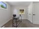 Simple office with neutral colors, natural light, and clean and modern desk at 1670 S Quieto Ct, Denver, CO 80223