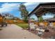 Backyard patio features a cozy seating area with fire pit, perfect for outdoor entertaining at 2140 S Youngfield St, Lakewood, CO 80228