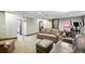 Spacious finished basement with seating, a stationary bike, and ample lighting at 2140 S Youngfield St, Lakewood, CO 80228
