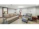 Finished basement area with comfortable seating, carpet, and natural light at 2140 S Youngfield St, Lakewood, CO 80228