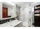 Charming bathroom featuring black tile, modern sink, and shower with decorative curtain at 2140 S Youngfield St, Lakewood, CO 80228