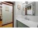 Bathroom features a marble countertop, green vanity, with a shower and toilet at 2140 S Youngfield St, Lakewood, CO 80228