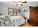 Well-lit bedroom with hardwood floors, neutral walls, and a large window at 2140 S Youngfield St, Lakewood, CO 80228