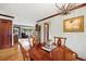 The dining room has hardwood floors and is situated between the living room and kitchen at 2140 S Youngfield St, Lakewood, CO 80228