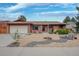 Charming single story home with a two car garage and xeriscaped front yard and walkway at 2140 S Youngfield St, Lakewood, CO 80228