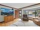 Inviting living room features an accent wall and beautifully carved front door at 2140 S Youngfield St, Lakewood, CO 80228