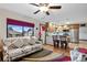 Comfortable living room with hardwood floors open to a kitchen with barstool seating at 2140 S Youngfield St, Lakewood, CO 80228