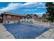 Large pool with a secure safety cover, surrounded by a well-maintained patio and fencing at 2140 S Youngfield St, Lakewood, CO 80228