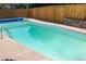 In-ground pool with a pristine, clear water, offering a refreshing backyard retreat at 2140 S Youngfield St, Lakewood, CO 80228