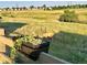 Backyard featuring a wooden fence, flower planter, and a deer grazing in the field at 5864 Turnstone Pl, Castle Rock, CO 80104