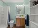 Bathroom with toilet, vanity with sink and medicine cabinet with a shower/tub at 5864 Turnstone Pl, Castle Rock, CO 80104