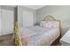 Guest bedroom with neutral walls, carpet, closet and window, features a golden metal bed at 5864 Turnstone Pl, Castle Rock, CO 80104